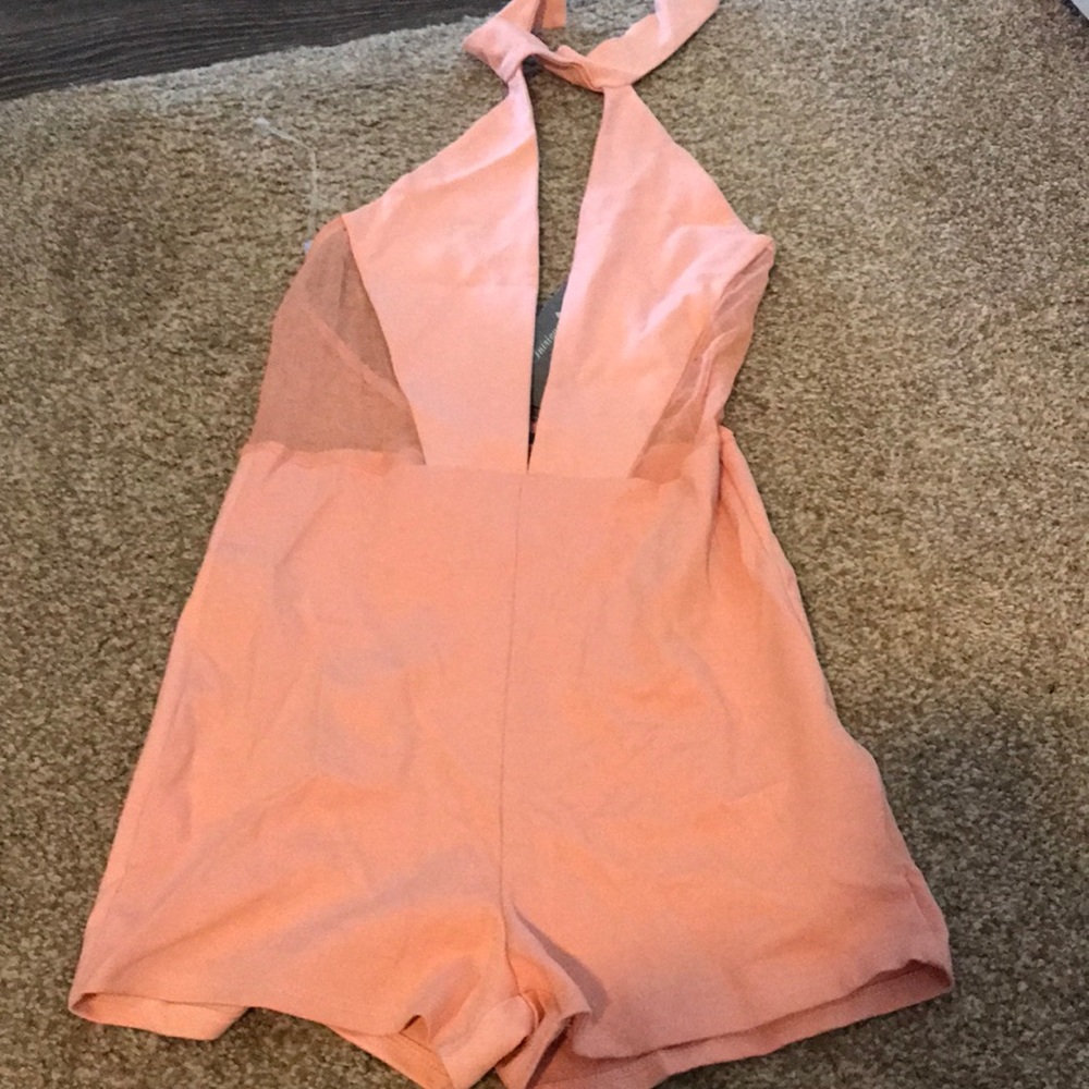 Pink romper from intrigue couture